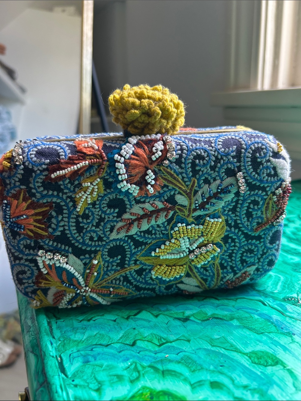 Hand-Embroidered Teal Floral Beaded Clutch with Yellow Pom